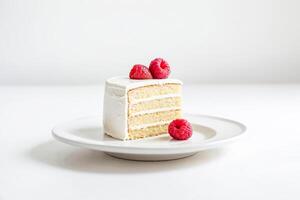 Single Slice of Vanilla Cake with Raspberries photo