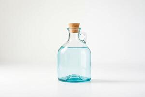 Blue glass bottle with cork stopper on white background photo