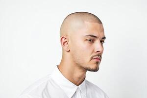 Close-up of a Man with a Shaved Head and a Goatee photo