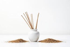 Incense Sticks and Dried Herbs on White Background photo