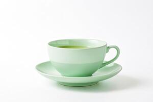 Green tea in a light green cup and saucer photo
