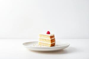 Slice of cake with raspberry on top photo