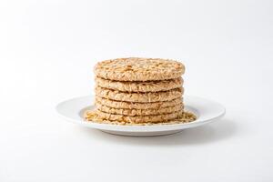Close-up of a Stack of Round Crackers on a White Plate photo