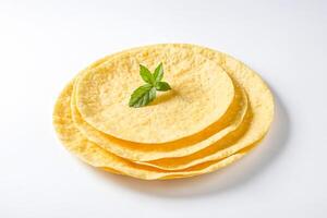 Stack of Sesame Tortillas with a Mint Leaf photo