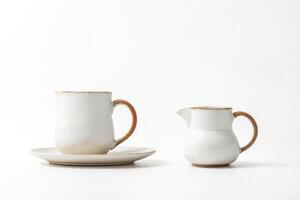 White Teacup and Pitcher Isolated on White Background photo