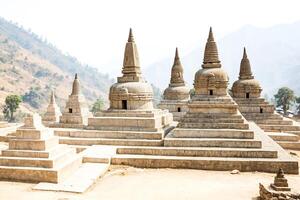 Ancient Buddhist Stupas in the Mountains photo