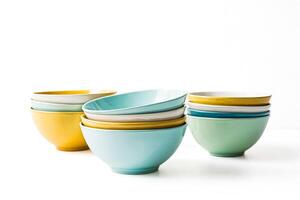 Stack of Colorful Bowls on White Background photo