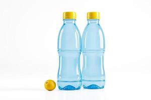 Two Blue Plastic Water Bottles with Yellow Caps and a Lemon on White Background photo