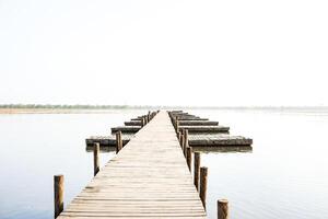 Wooden path leading to the horizon photo