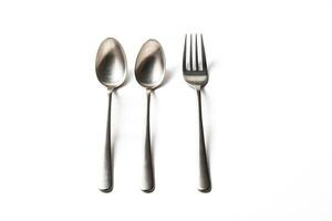 Two Spoons and a Fork on a White Background photo