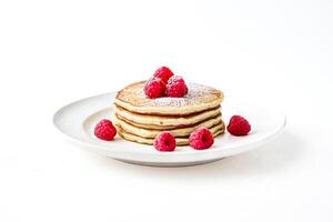 Stack of Pancakes with Raspberries and Powdered Sugar photo