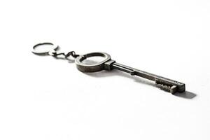 Closeup of a Key with Keyring on a White Background photo