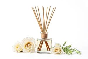 White Roses and Reed Diffuser on White Background photo