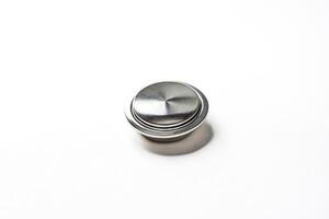 Close-up of a Round, Silver-Colored Button with a Shiny Finish photo