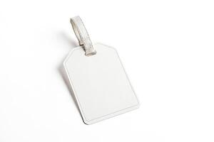 Blank white tag with string loop isolated on white background photo