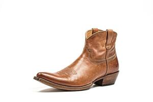 Brown Leather Cowboy Boot Isolated on White Background photo