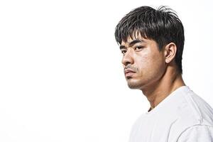 Man looking off to the side with serious expression photo