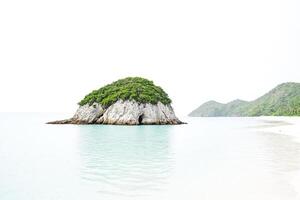 Tranquil Island with a Cave in the Rocks photo