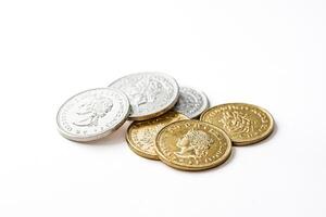 Gold and silver coins on a white background photo