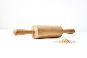 Wooden Rolling Pin and Flour on White Background photo