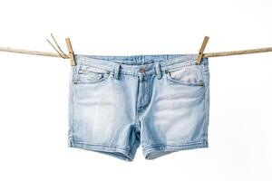 Light Blue Denim Shorts Hanging on a Clothesline photo