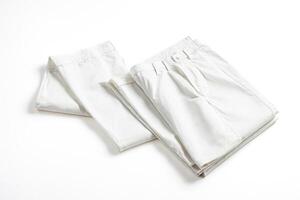 Folded White Pants on White Background photo