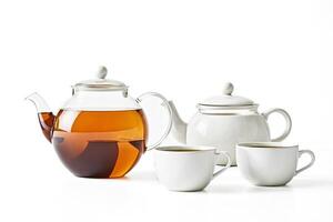 Teapot and cups of tea photo
