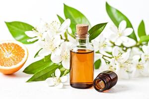 Orange Blossom Essential Oil Bottle with Flowers and Orange Slice photo