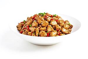 Close up of chicken with chili peppers in a white bowl photo