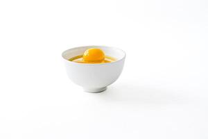 Single Egg Yolk in a White Bowl photo
