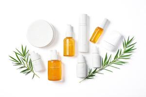 Skincare Products with Green Leaves on White Background photo