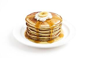Stack of Pancakes with Banana and Whipped Cream photo