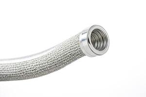 Close-up of a Metallic Mesh Tube with a Shiny End photo