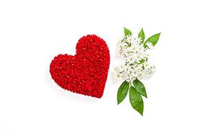 Red Flower Heart with White Flowers and Green Leaves on White Background photo