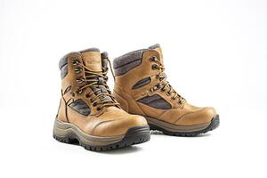 Pair of brown leather boots with grey lining photo
