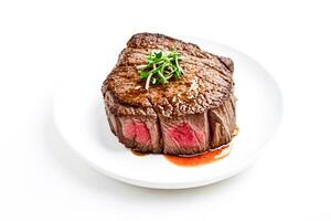 Close-up of a grilled steak on a white plate photo