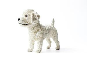 White fluffy dog figurine isolated on white background photo