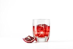 Pomegranate juice with ice cubes in a glass photo