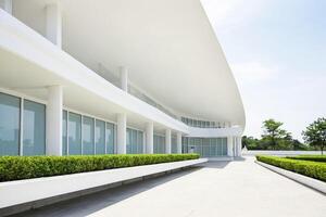 Modern White Building With Green Bushes photo