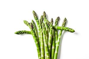 Bunch of fresh asparagus on white background photo
