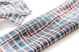 Close-up of blue and red checkered fabric with white threads photo