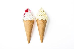 Two ice cream cones with different toppings photo