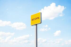 Yellow Sign With Scope Text Against Cloudy Sky photo