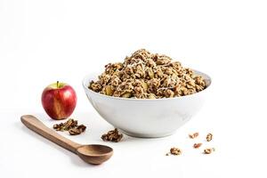Granola with Apple and Nuts in White Bowl photo