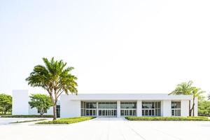Modern White Building with Palm Trees photo