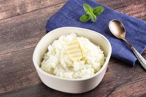 Homemade rice porridge with butter photo