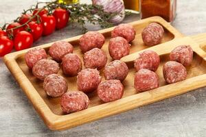 Uncooked raw beef meatball minced photo