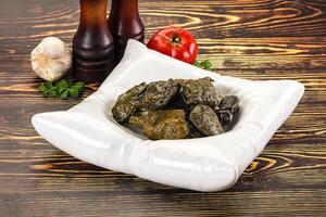 Stuffed dolma - meat in grape leaves photo