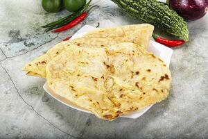 Indian tandori bread - naan with cheese photo