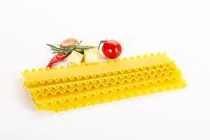 Uncooked raw Lasagna dry sheets photo